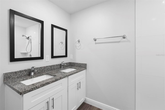 bathroom featuring vanity and hardwood / wood-style flooring