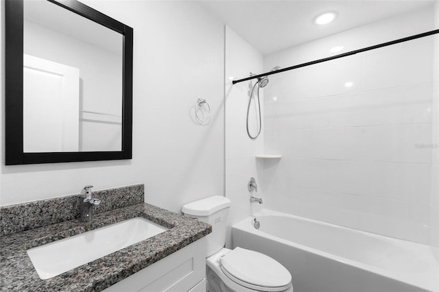 full bathroom with vanity, toilet, and tiled shower / bath combo