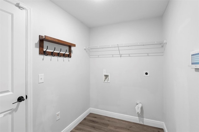 clothes washing area featuring dark wood-type flooring, hookup for a washing machine, and electric dryer hookup