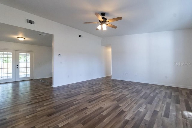 spare room with ceiling fan, dark hardwood / wood-style flooring, and french doors