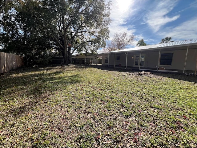 view of yard with french doors