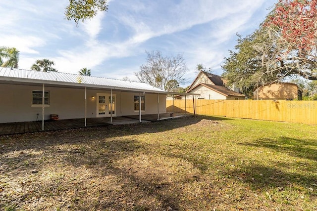 view of yard with french doors