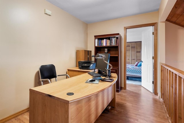 office area with wood-type flooring