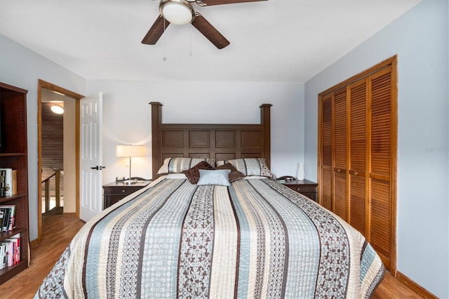 bedroom featuring ceiling fan, light hardwood / wood-style floors, and a closet