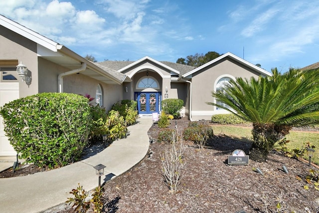 ranch-style house featuring french doors