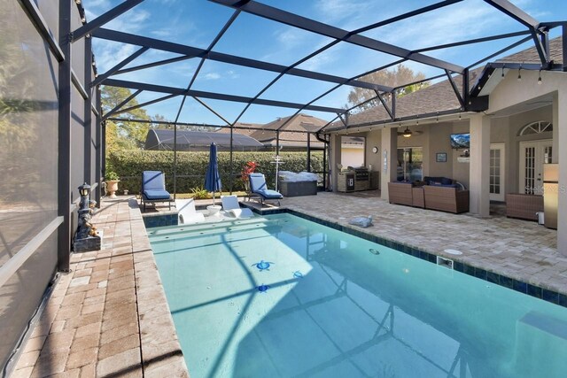 428 Hightower Dr, Debary, FL 32713 - view of swimming pool with a ceiling fan, glass enclosure, a patio, an outdoor hangout area, and a fenced in pool