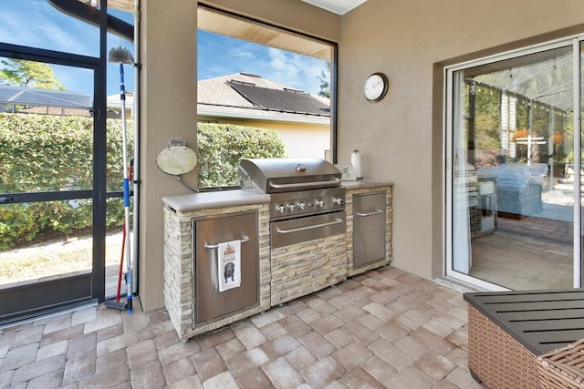 428 Hightower Dr, Debary, FL 32713 - exterior space featuring a lanai, an outdoor kitchen, and a grill