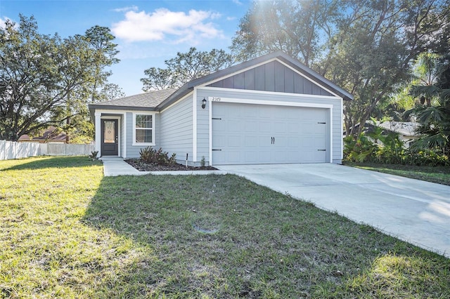 ranch-style home featuring a garage and a front lawn