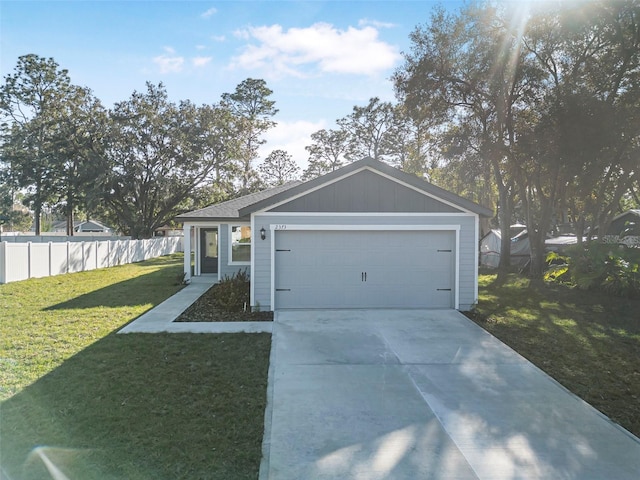 single story home featuring a garage and a front yard