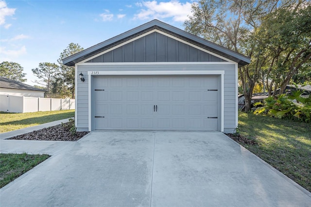 garage featuring a lawn