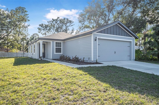 single story home with a garage and a front lawn