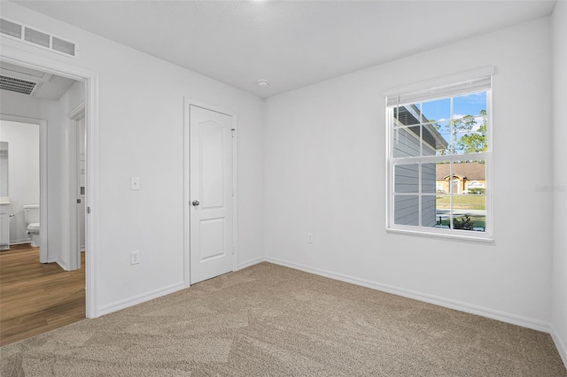 unfurnished bedroom with carpet floors