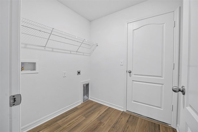 laundry area with hardwood / wood-style floors, hookup for a washing machine, and hookup for an electric dryer