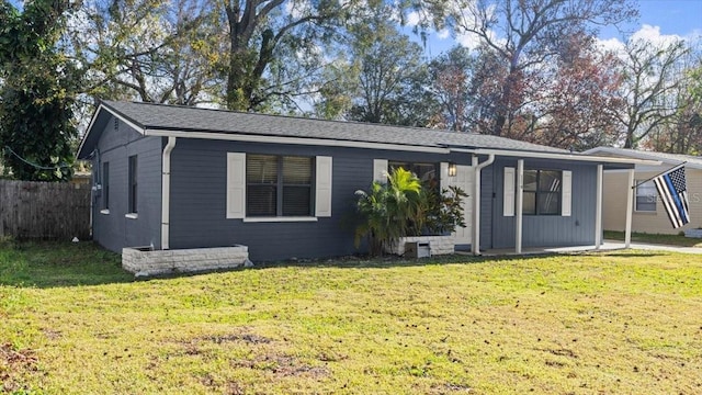 single story home featuring a front lawn