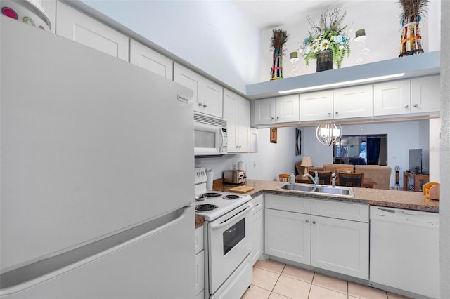 kitchen featuring white cabinetry, white appliances, light tile patterned flooring, and sink