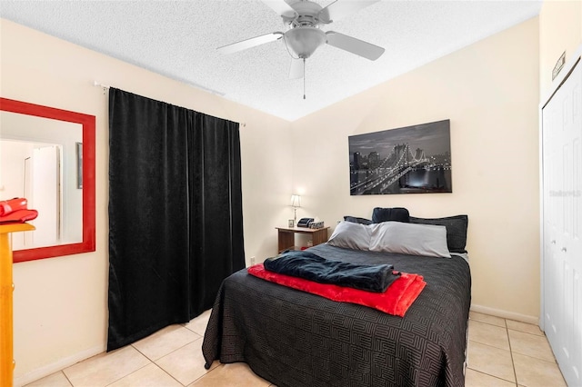 245 Terrace Hill Blvd Unit 1E, Debary, FL 32713 - tiled bedroom with a ceiling fan and a textured ceiling