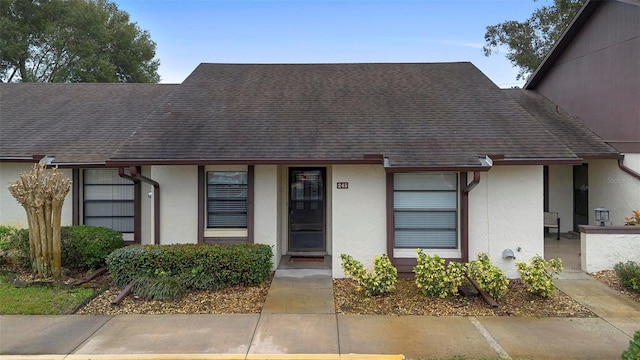 245 Terrace Hill Blvd Unit 1E, Debary, FL 32713 - view of front of home with stucco siding and a shingled roof
