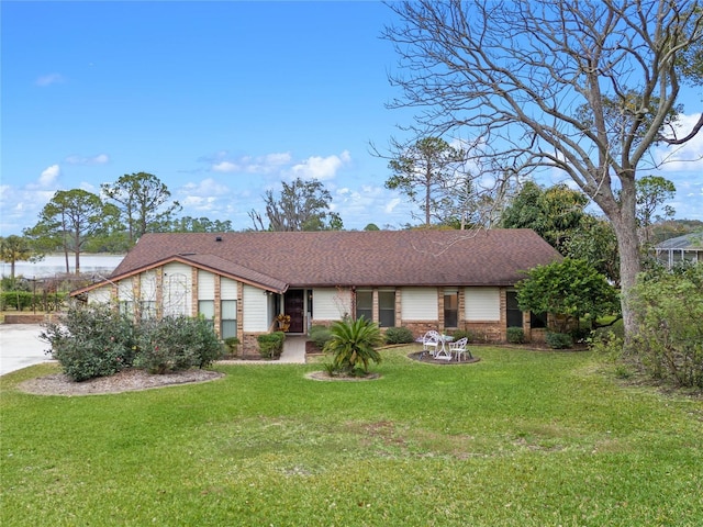 ranch-style house with a front lawn