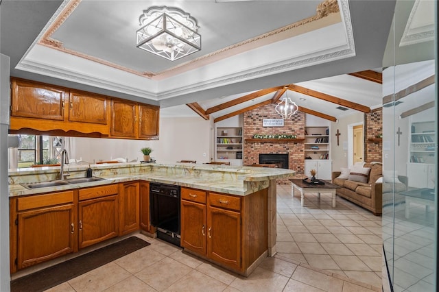 kitchen featuring built in features, dishwasher, sink, a chandelier, and kitchen peninsula