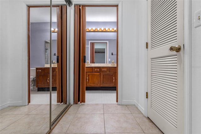 hallway featuring light tile patterned floors