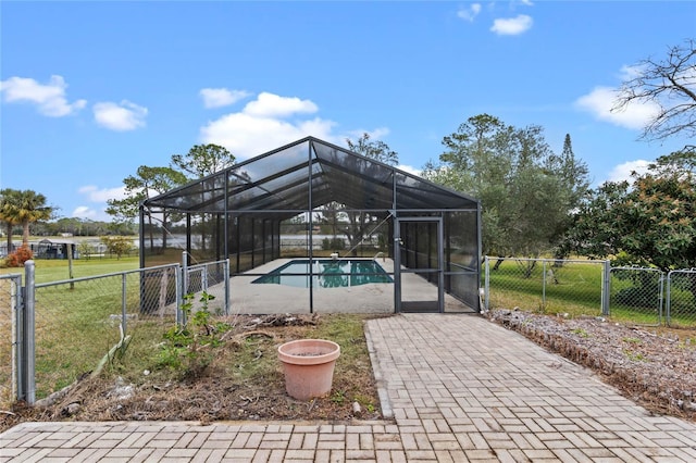 view of pool featuring a lanai and a yard