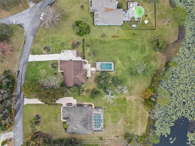 birds eye view of property featuring a water view