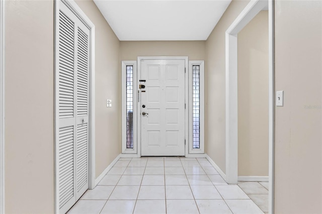 foyer entrance featuring light tile patterned flooring