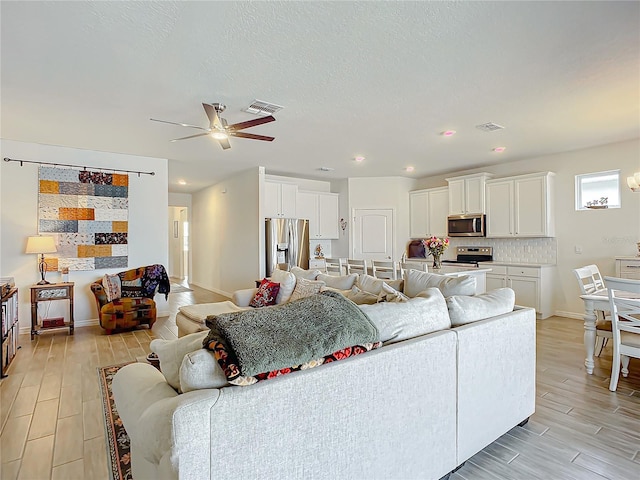 living room featuring ceiling fan