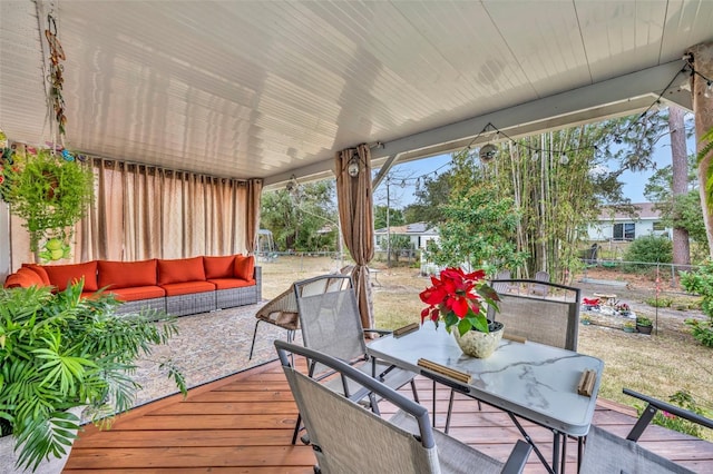 deck with a patio and outdoor lounge area