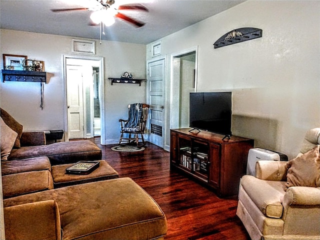 living room with dark hardwood / wood-style flooring and ceiling fan