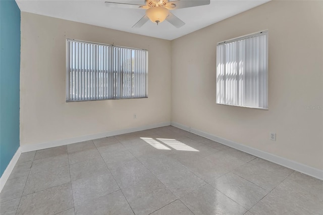 tiled empty room with ceiling fan