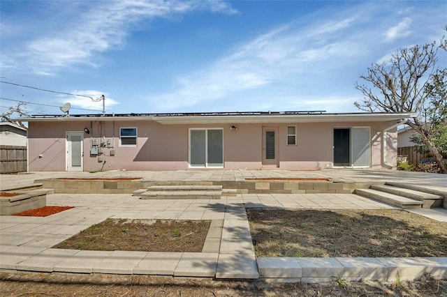 back of house with a patio