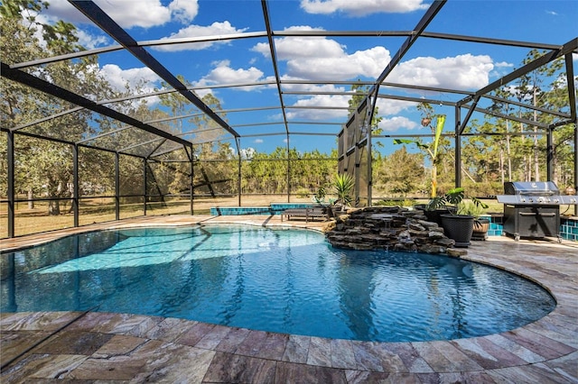 view of pool with a patio and glass enclosure