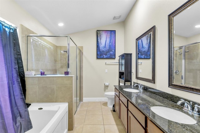 full bathroom featuring vanity, tile patterned floors, shower with separate bathtub, and toilet