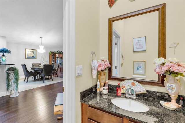 bathroom featuring hardwood / wood-style flooring and vanity