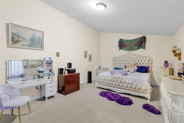 bedroom with light carpet and a textured ceiling