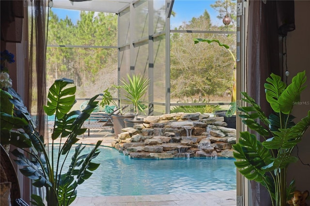 view of swimming pool with pool water feature