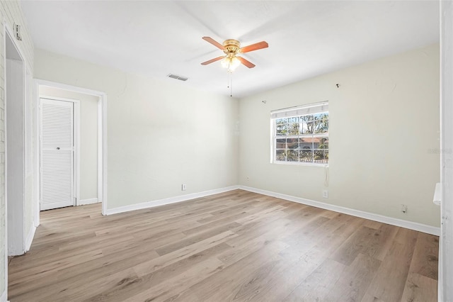 spare room with ceiling fan and light hardwood / wood-style flooring