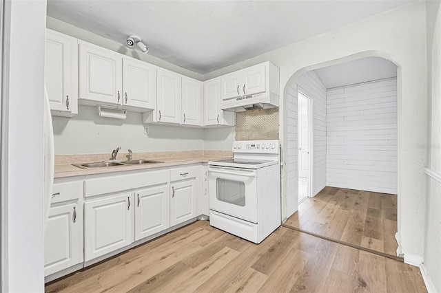 kitchen featuring white cabinetry, sink, light hardwood / wood-style floors, and electric stove