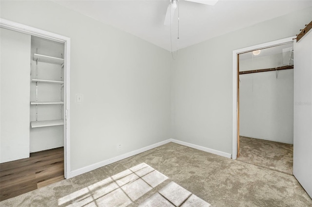 unfurnished bedroom with ceiling fan, carpet floors, and a closet