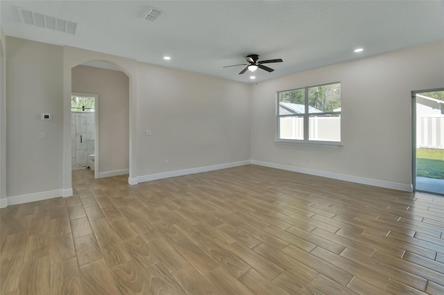 spare room featuring ceiling fan and light hardwood / wood-style flooring