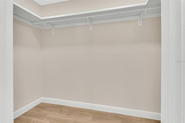 spacious closet with wood-type flooring