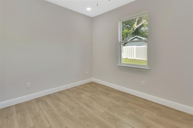 unfurnished room featuring light hardwood / wood-style flooring