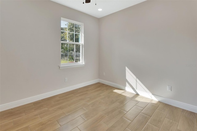 spare room with ceiling fan