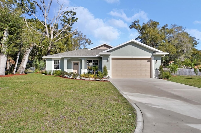 ranch-style house with a garage and a front yard