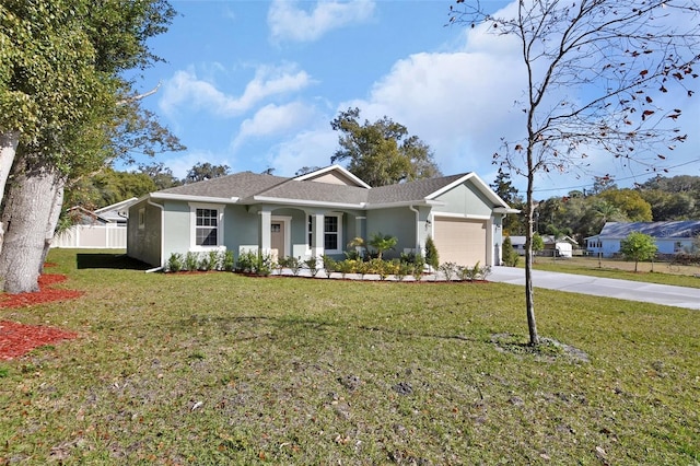 ranch-style house with a garage and a front yard