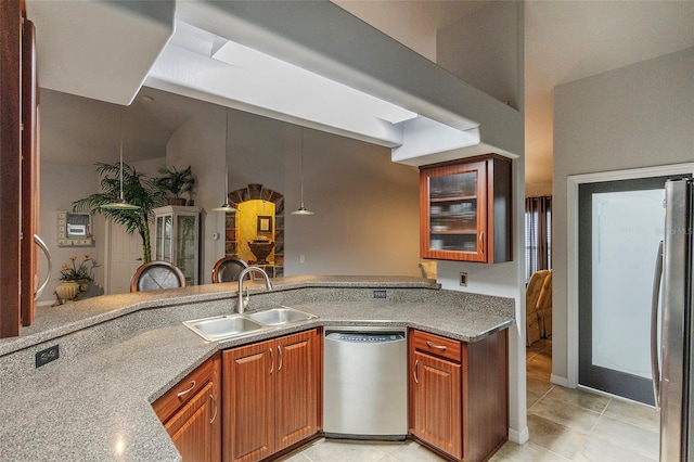 kitchen featuring appliances with stainless steel finishes, sink, and light tile patterned floors