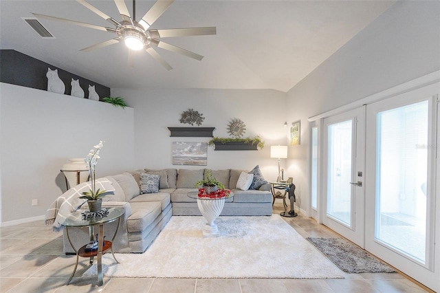 living area with french doors, visible vents, vaulted ceiling, and a healthy amount of sunlight