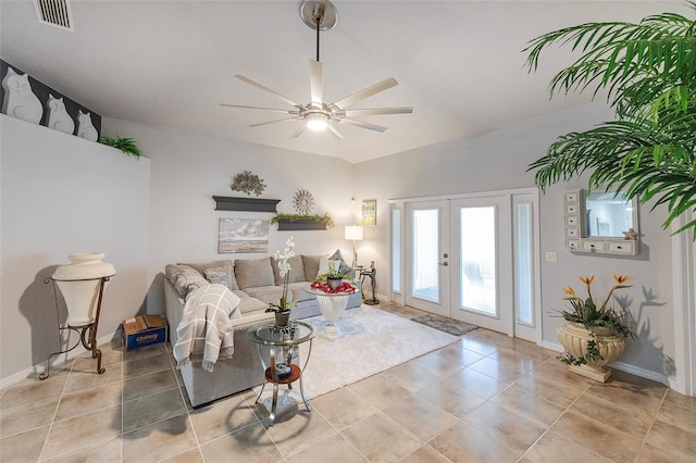 living area featuring light tile patterned floors, ceiling fan, visible vents, baseboards, and french doors