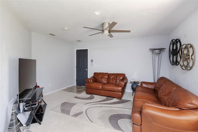 living room featuring carpet floors, visible vents, ceiling fan, and baseboards